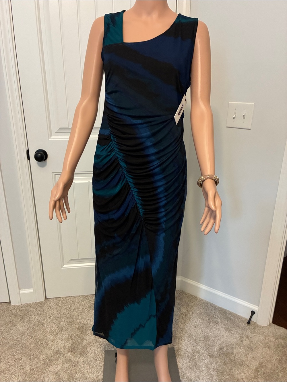 Sleeveless Teal and Black Ruched Midi Dress by DKNY.